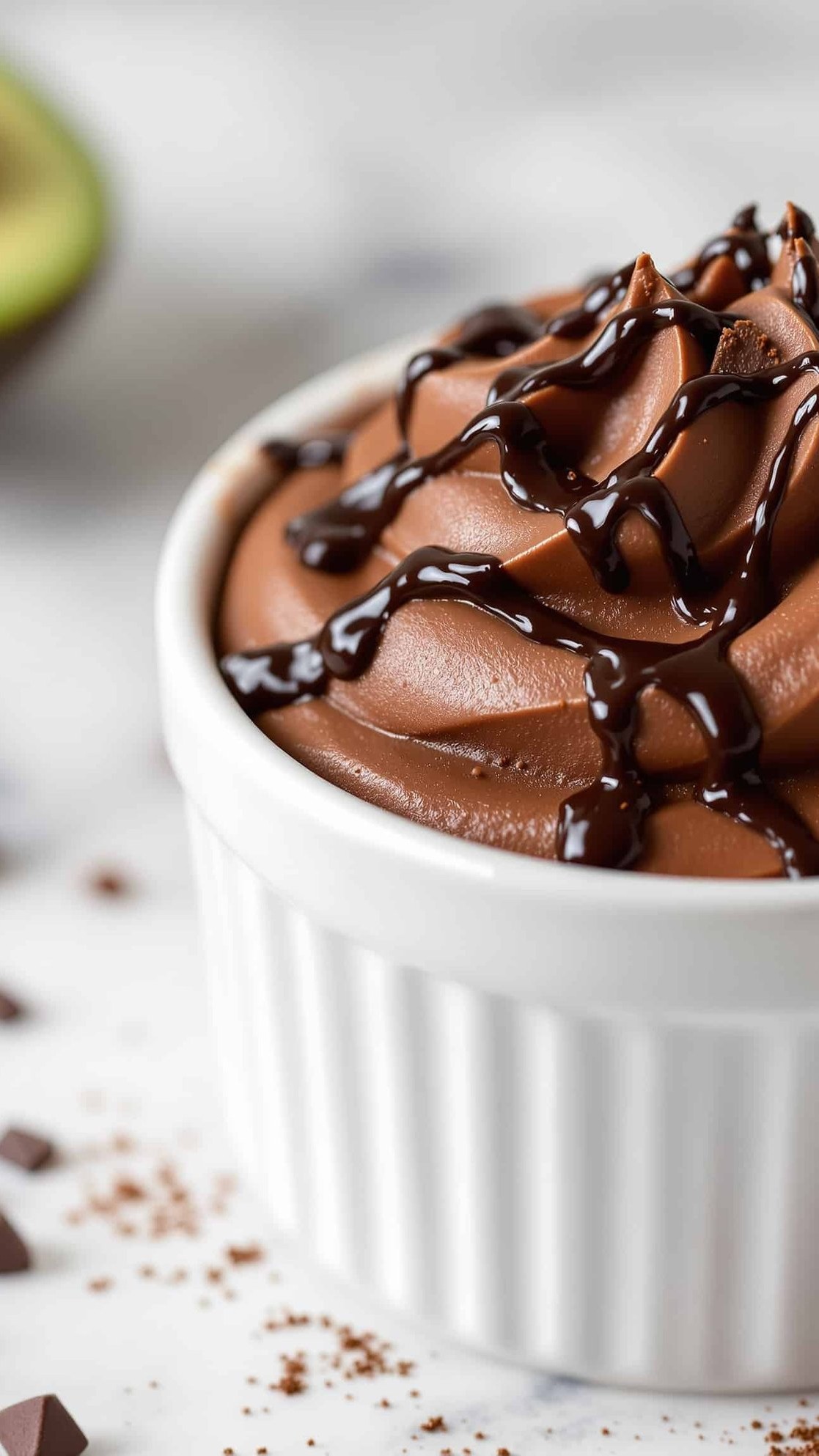 Close-up of brun dark chocolate avocado mousse, a blood sugar friendly dessert.